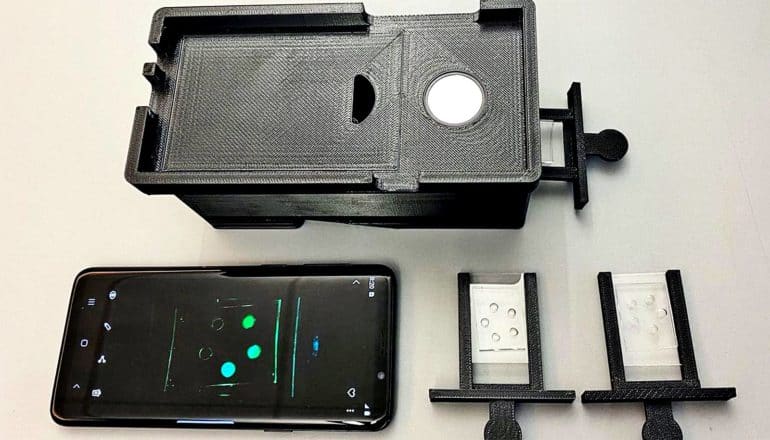 The prototype is a phone case that can hold slides, which then appear on the phone screen