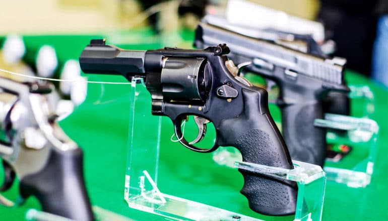 A row of handguns for sale