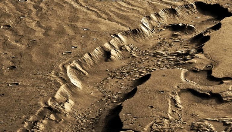 A deep valley appears on the surface of Mars