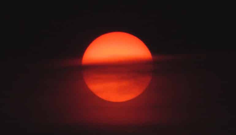 cloud in front of red sun