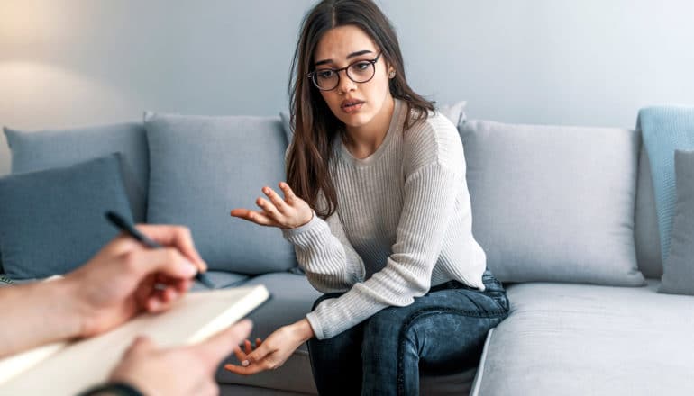 person speaking to counselor