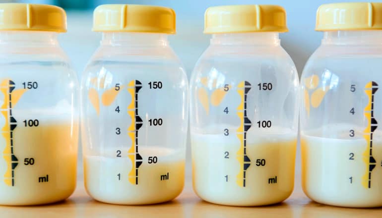 Plastic bottles of breastmilk side by side