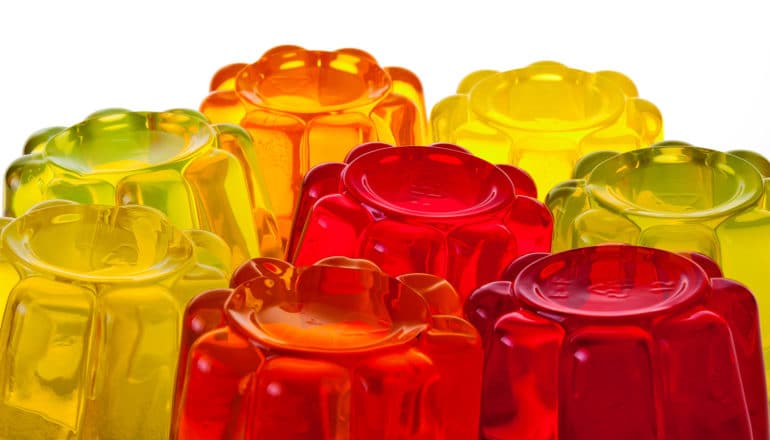 Several differently colored Jello molds against a white background