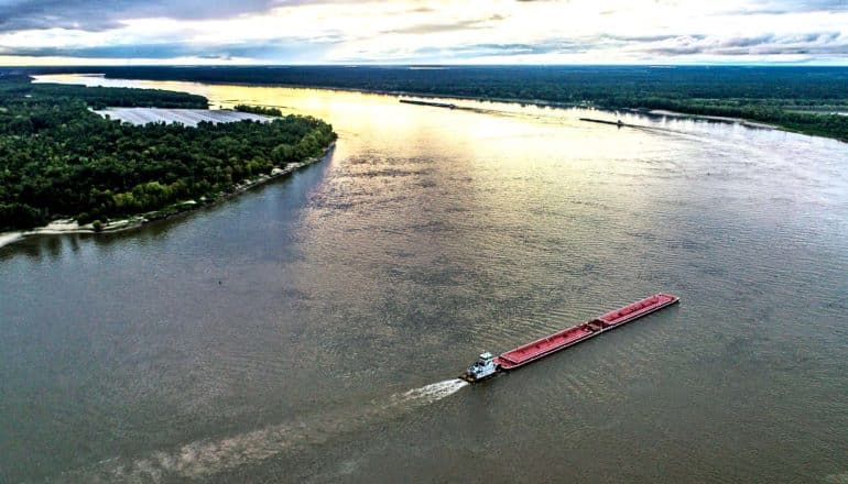 An aerial shot of ships traveling along the Mississippi River