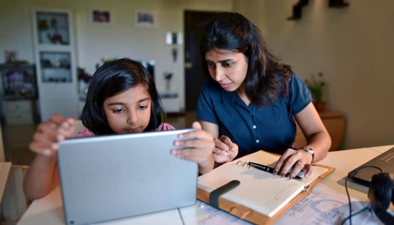 mother and child at laptop at home