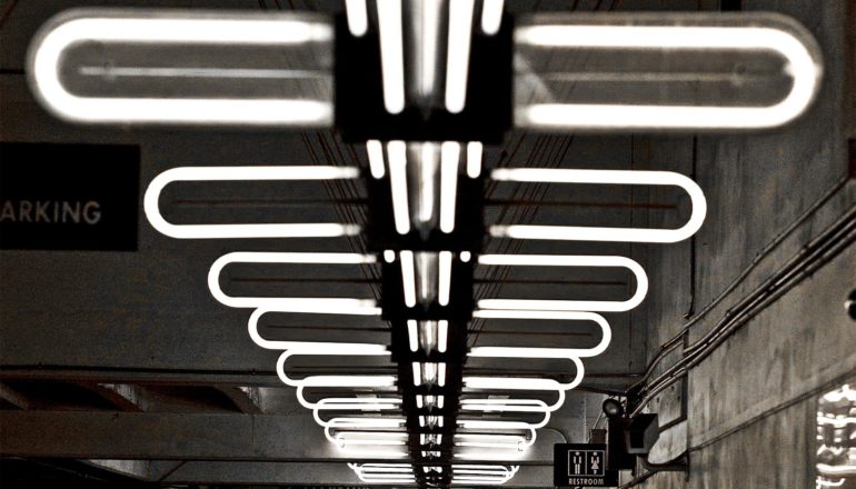 Lights in a row on a parking lot ceiling look like a spinal cord