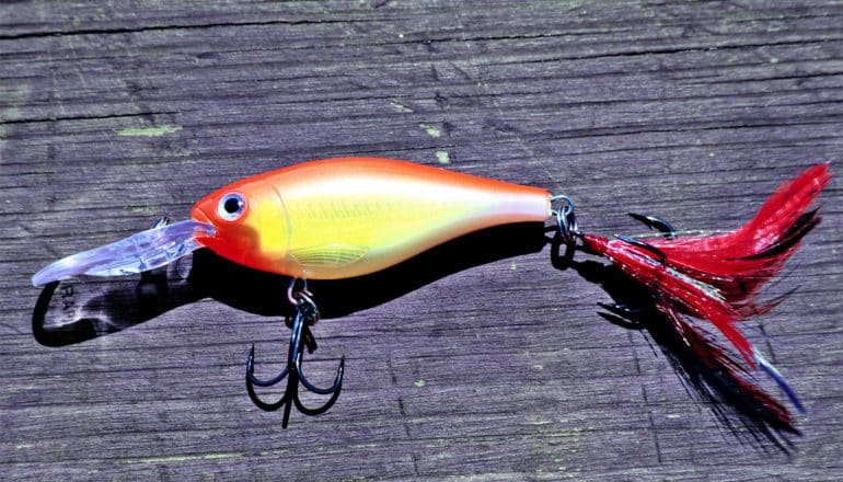 A bright yellow and red fishing lure