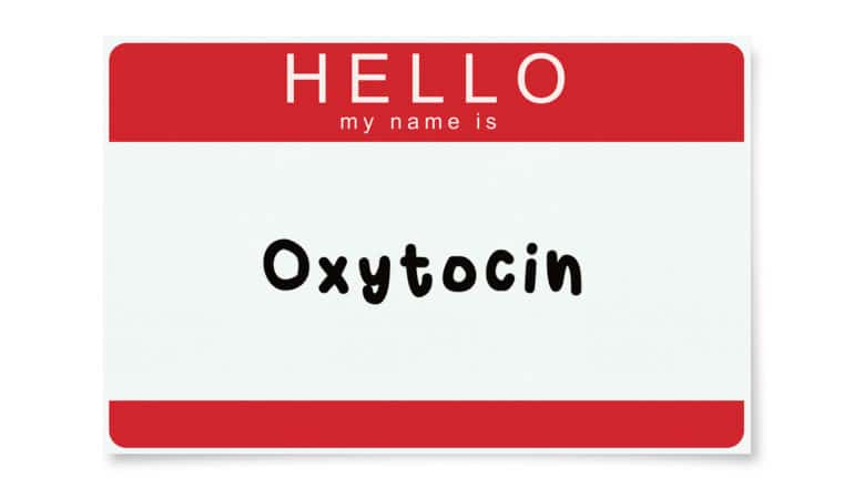 sticker nametag says "HELLO My name is" with "oxytocin" written below