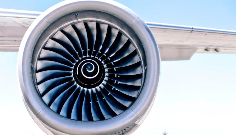 A jet engine turbine on a plane wing