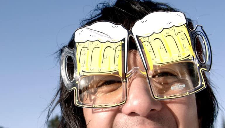 person wearing glasses that look like steins of beer