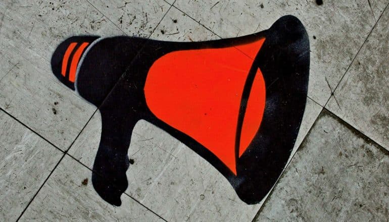 A megaphone painted on concrete