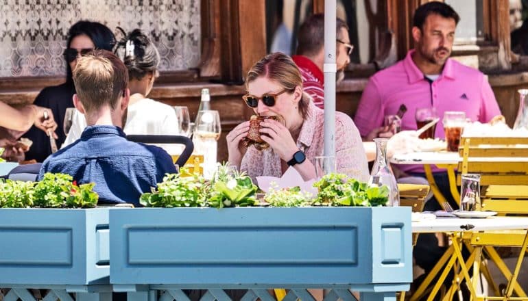 People eat at a restaurant outside