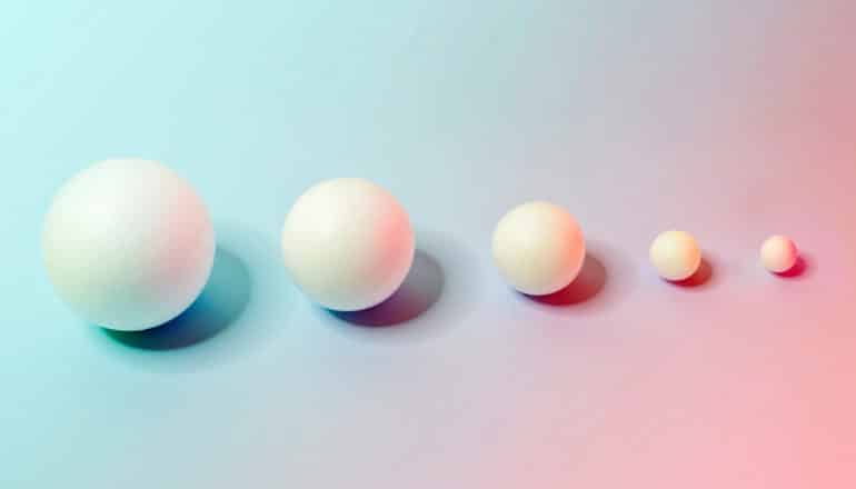 row of progressively smaller spheres