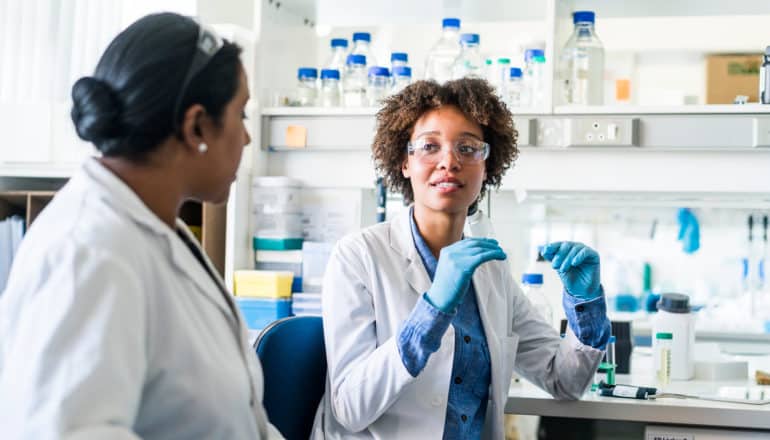 two women of color in laboratory