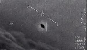 A video still shows a dark object in the sky