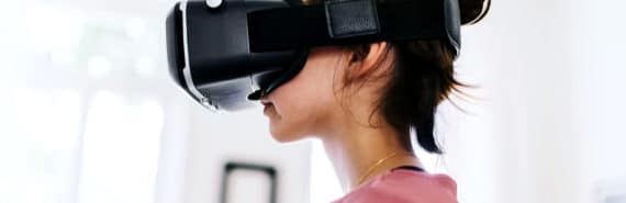 A young girl with a virtual reality headset on