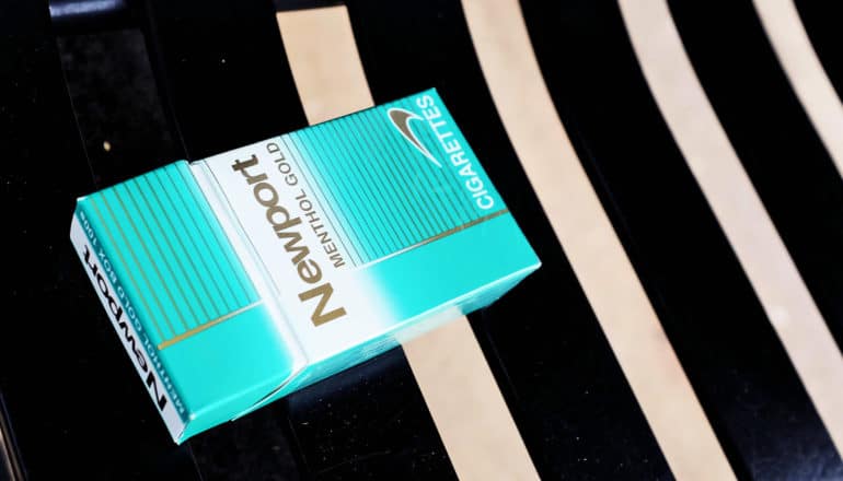 pack of Newport menthols on bench