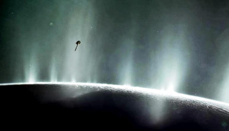 Cassini is tiny in a shot of plumes shooting from the surface of Enceladus