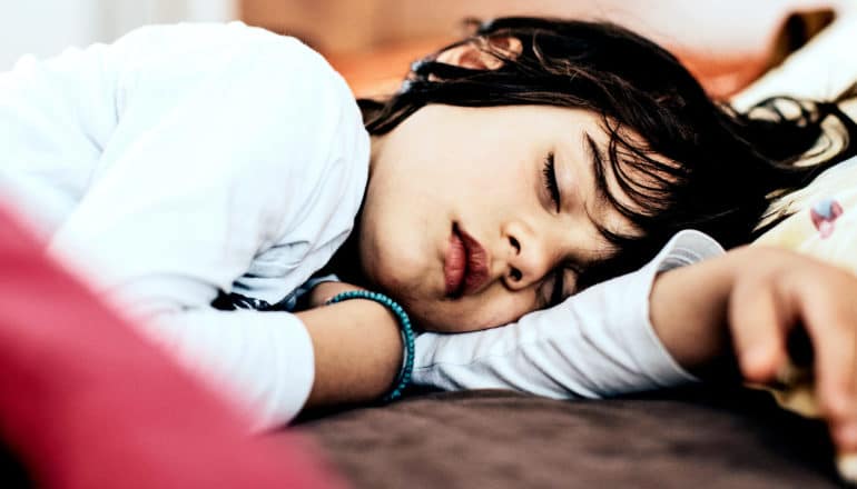 A child sleeping in bed