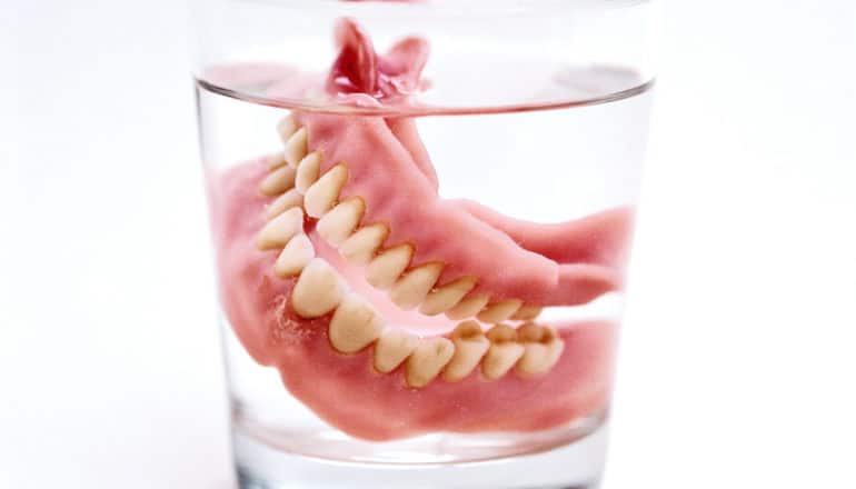 Dentures in a glass of water