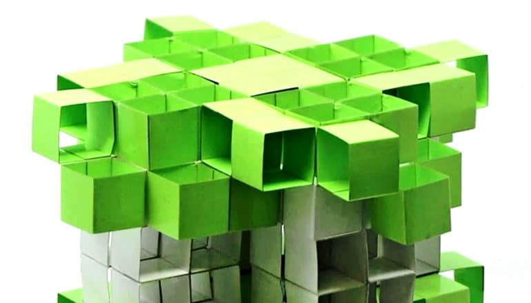 Green and white kirigami boxes make a tower shape