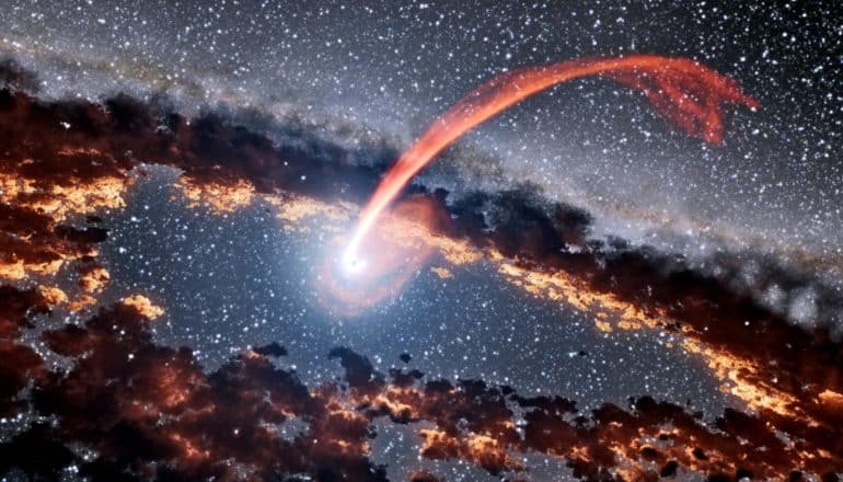 A black hole devours a star (shown as a streak of red light) surrounded by a ring of cloudy dust