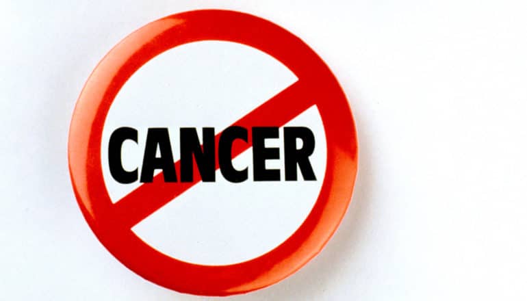 A button with the word "cancer" on it, circled in red with a line through it