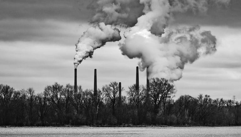 clouds billow from smokestacks