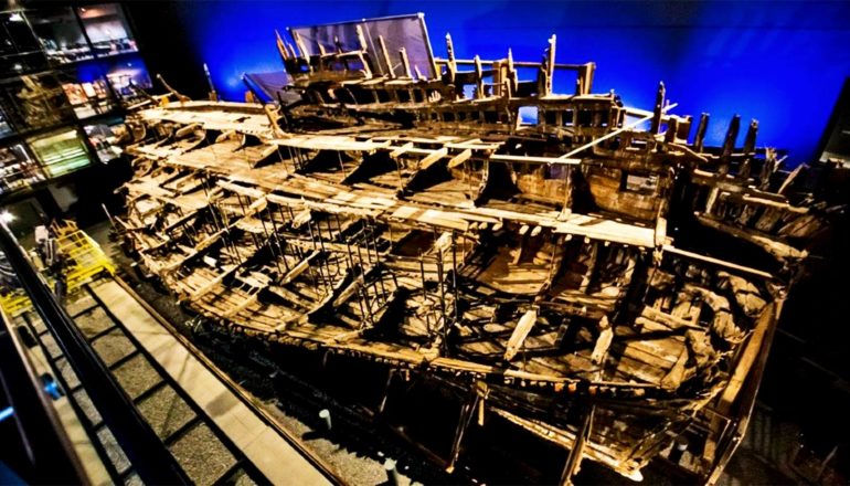 The remains of the Mary Rose sit in a large room