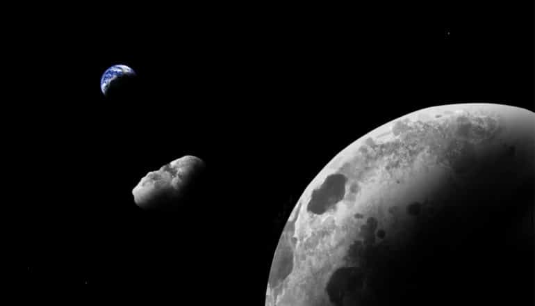 Kamo`oalewa floats in space between the moon in the foreground and the Earth in the background