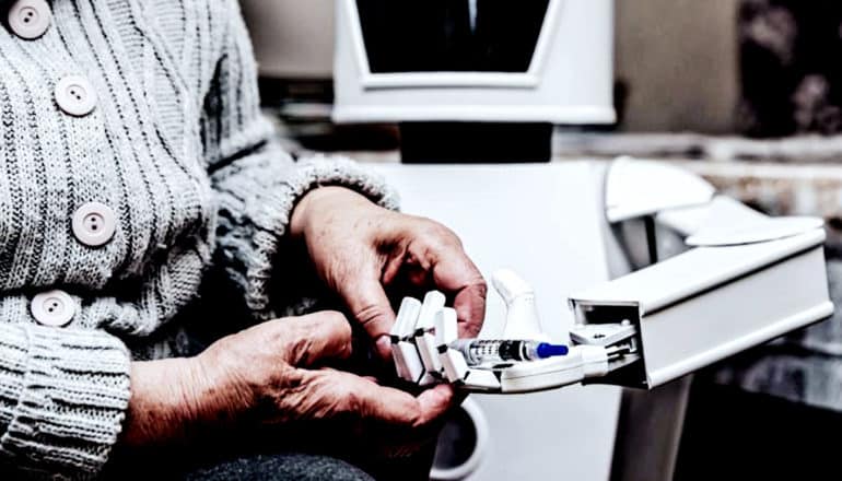 A white, polished robot hands a woman a syringe of medication