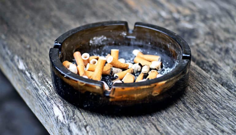 An ashtray full of cigarette butts