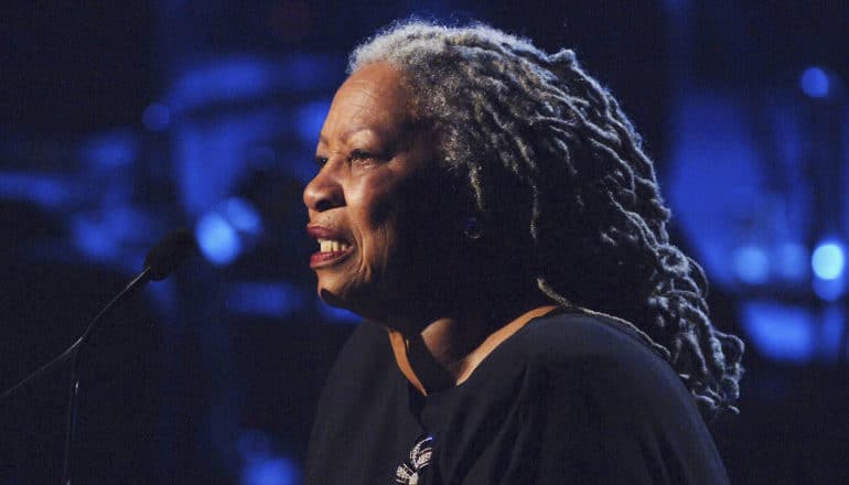 Toni Morrison speaks into mic