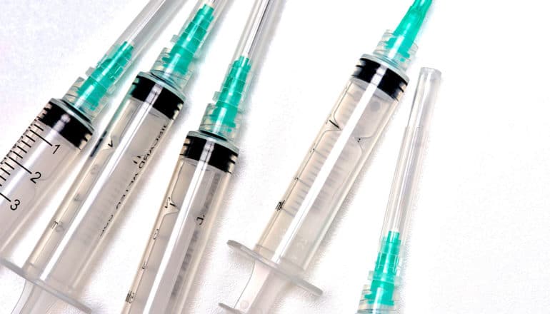 Medical syringes on a white background