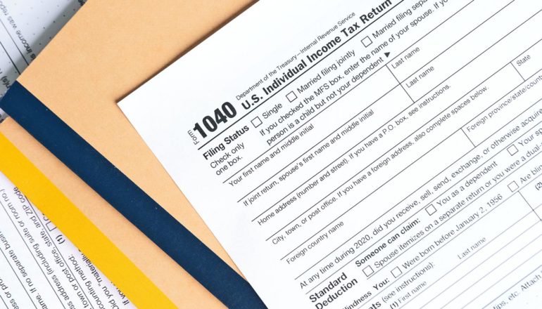 1040 tax form on top of folders