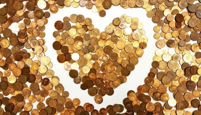 Coins arranged in the shape of a heart