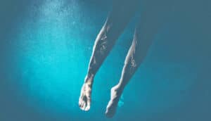 A swimmer's legs underwater.