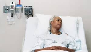 Black woman in hospital bed