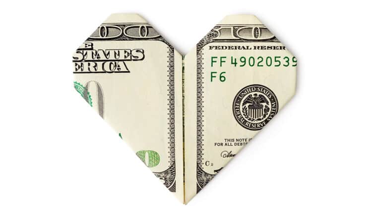 $100 bill folded into heart shape