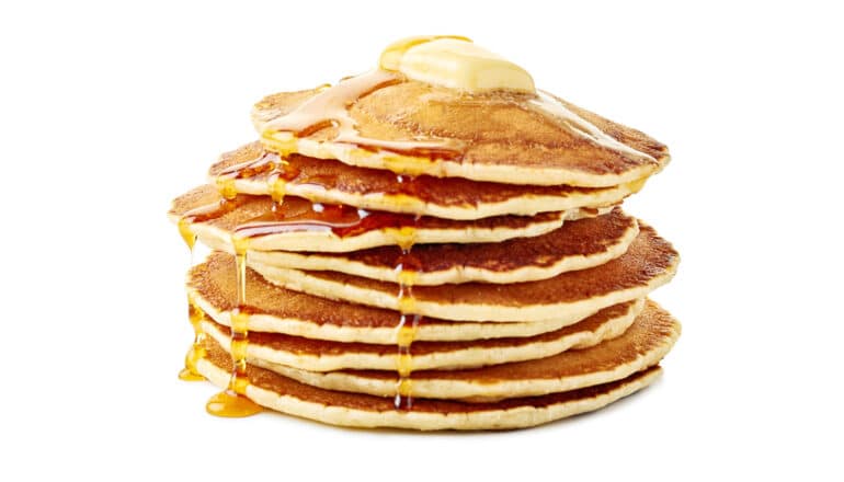 stack of pancakes with butter and syrup