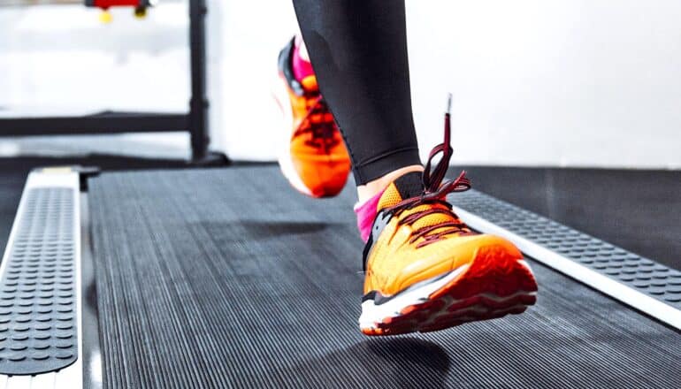 colorful sneakers of person on treadmill