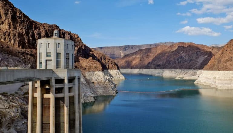 reservoir with low water amid mountains