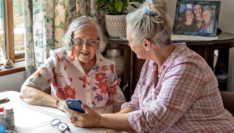 older adults shows elderly adult something on phone