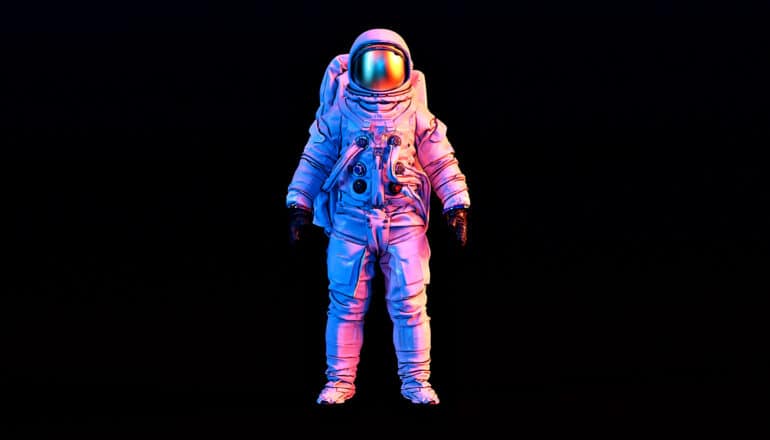 astronaut in pink/blue lighting on black background