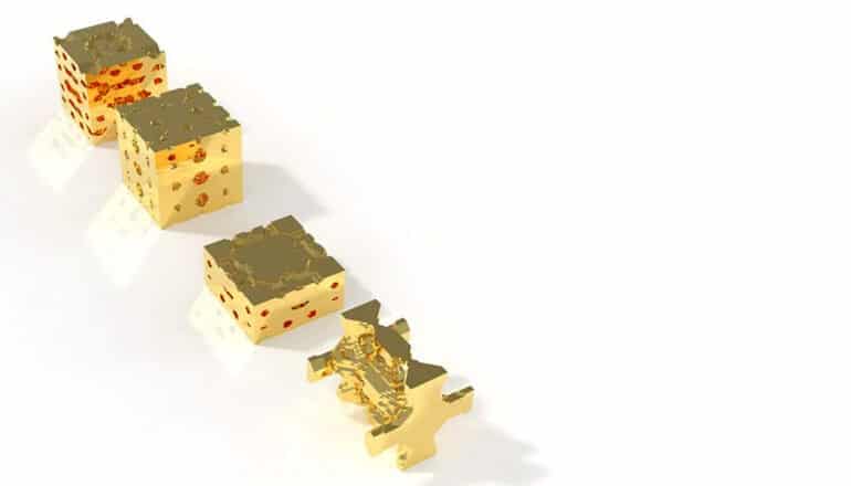 row of four gold cubes of increasing complexity