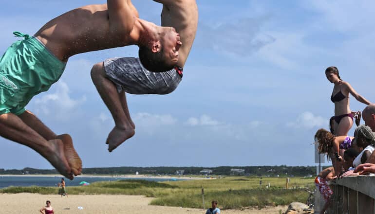 people jump off bridge at beach