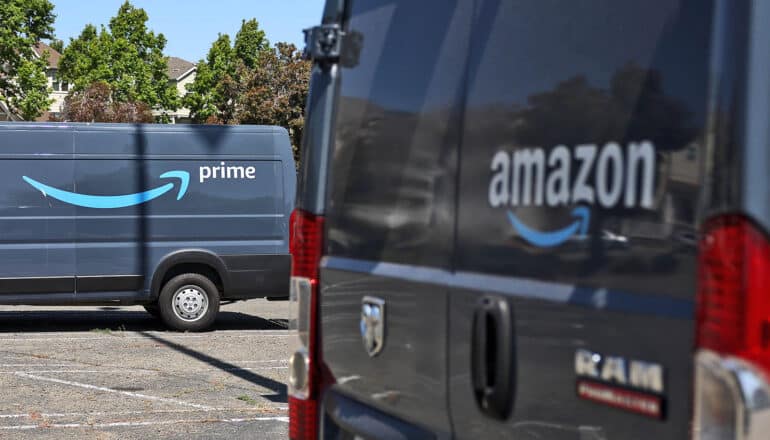 two Amazon prime trucks