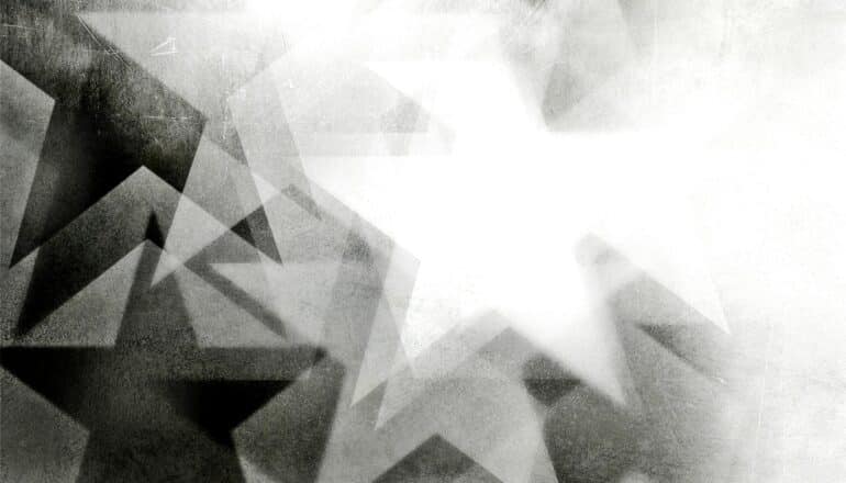 A black star fades into a white star.