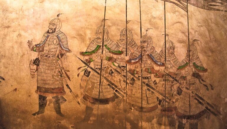 A Tang Dynasty fresco from a tomb shows soldiers lining up behind a commander.