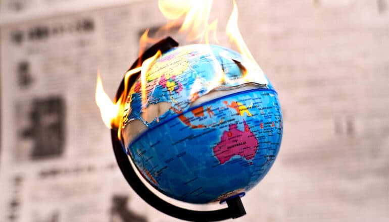 A globe covered in flames.